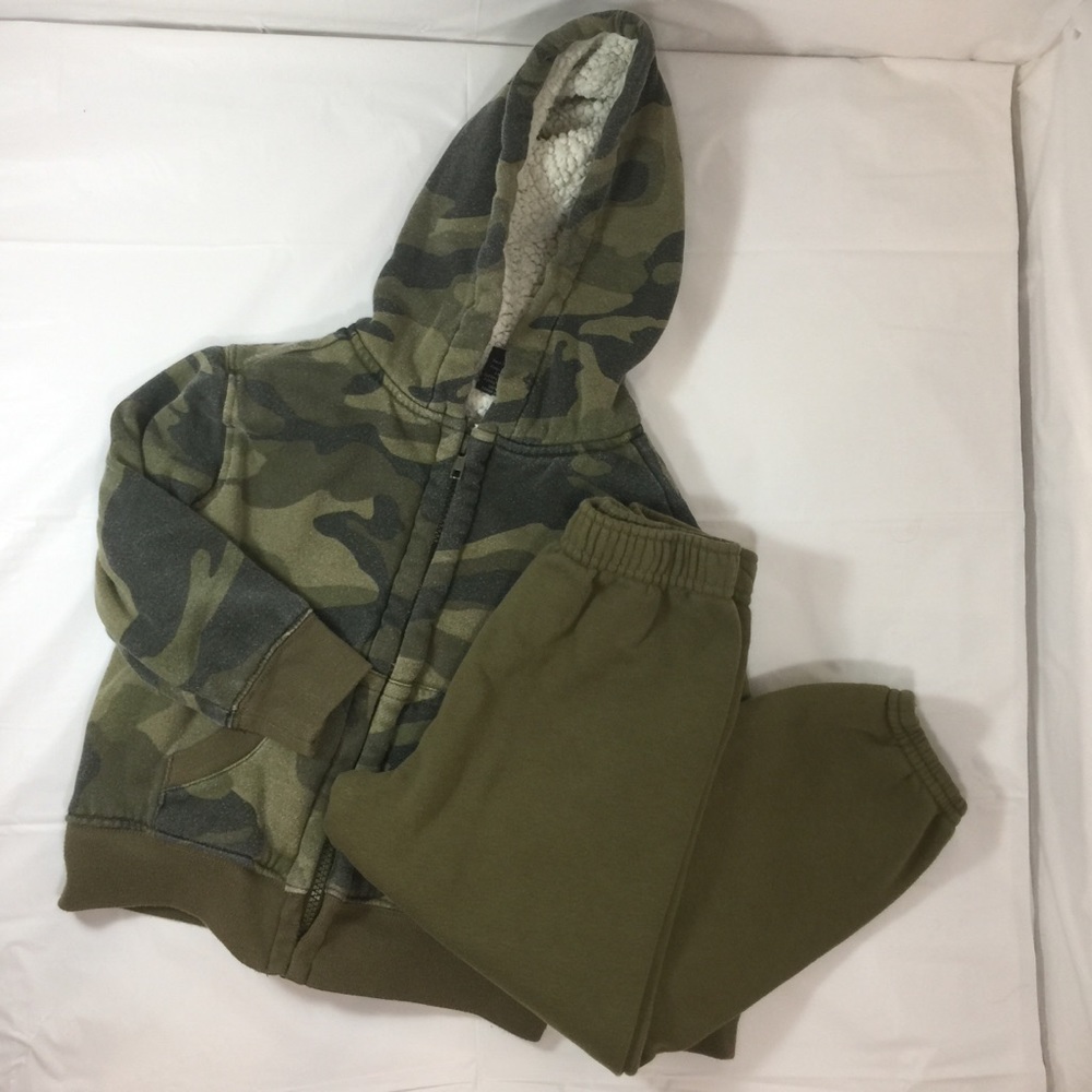 Camo jacket and green sweatpants